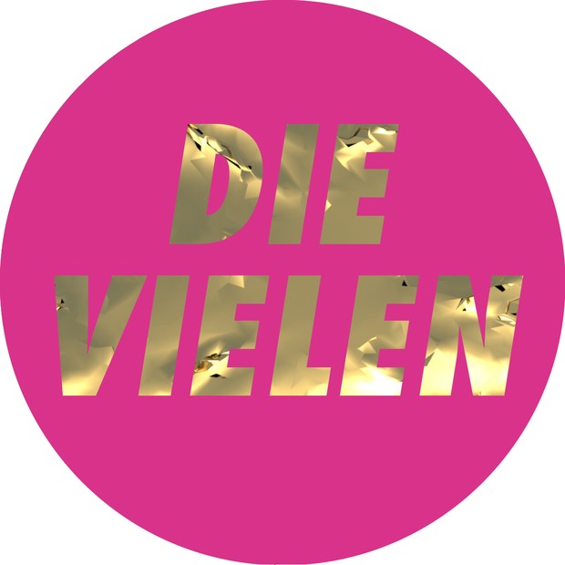 ein pinkfarbener Kreis, darin in goldenen Großbuchstaben die Inschrift "Die Vielen"